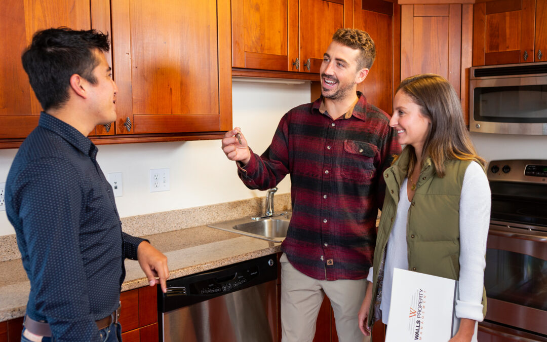 Property Manager handing off keys to their new resident