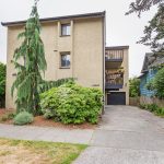 Apartment Building Exterior - 62nd Ave Apartments - Front Entrance