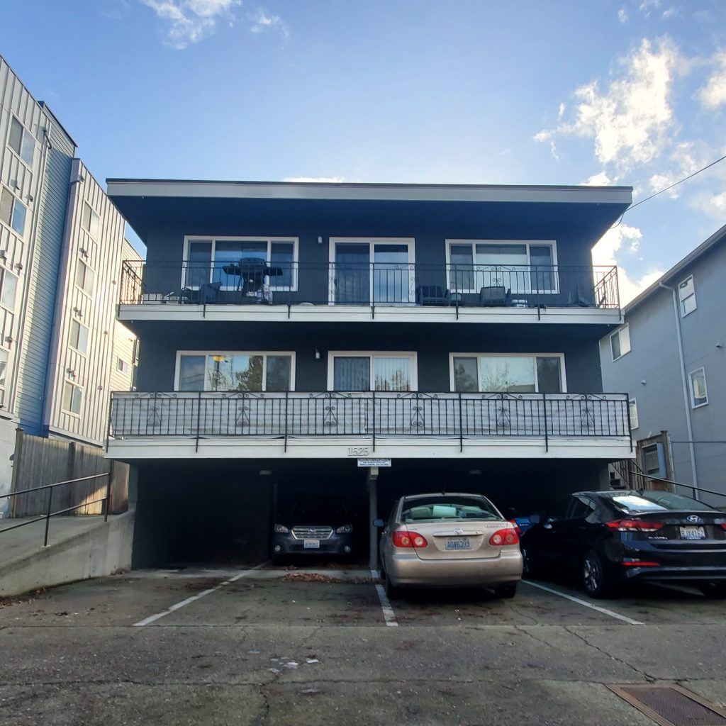 1525 NW 52nd St Property exterior with carport and patio decks